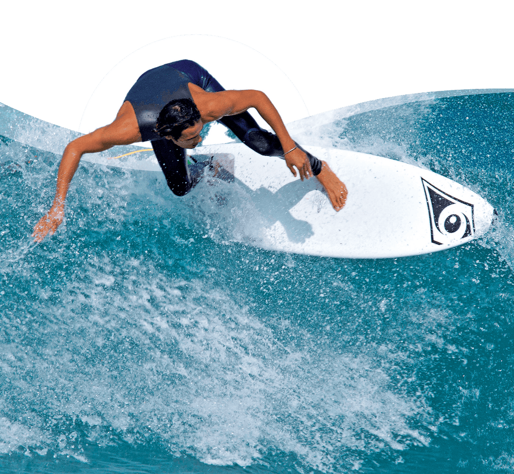 Action shot of a surfer catching a wave on a Bic Sport board in the ocean
