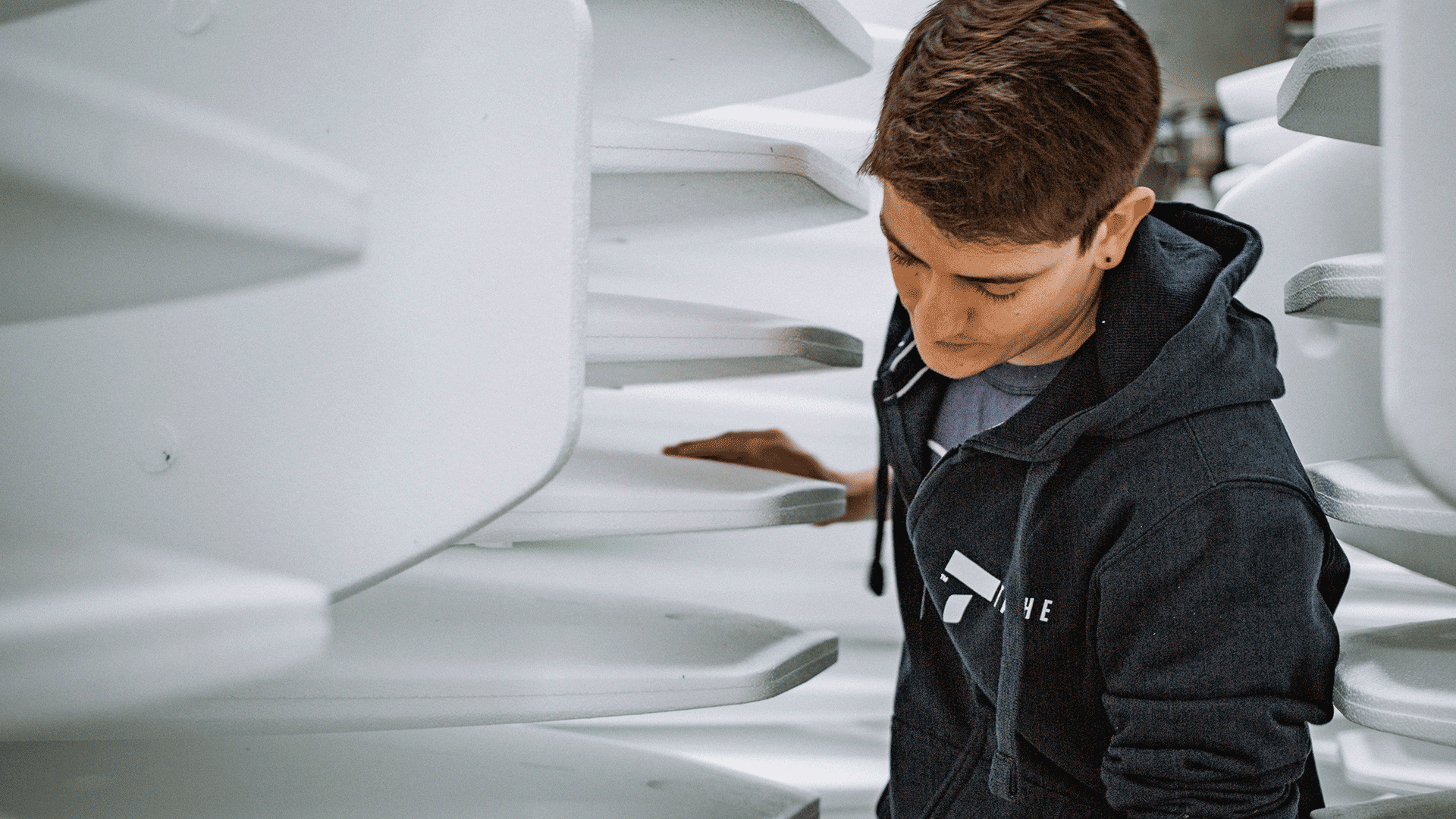 TAHE team member conducting a quality check on raw manufacturing materials.