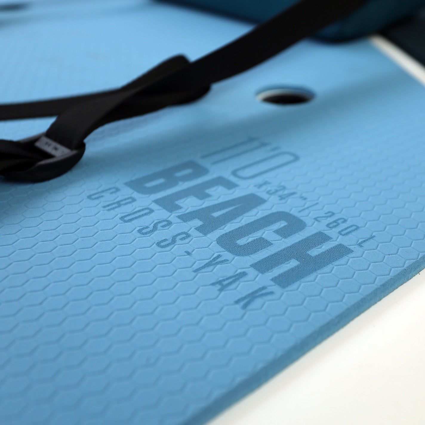 Detailed view of the blue deck pad on the TAHE Beach Cross-Yak 11'0'' hybrid paddleboard.
